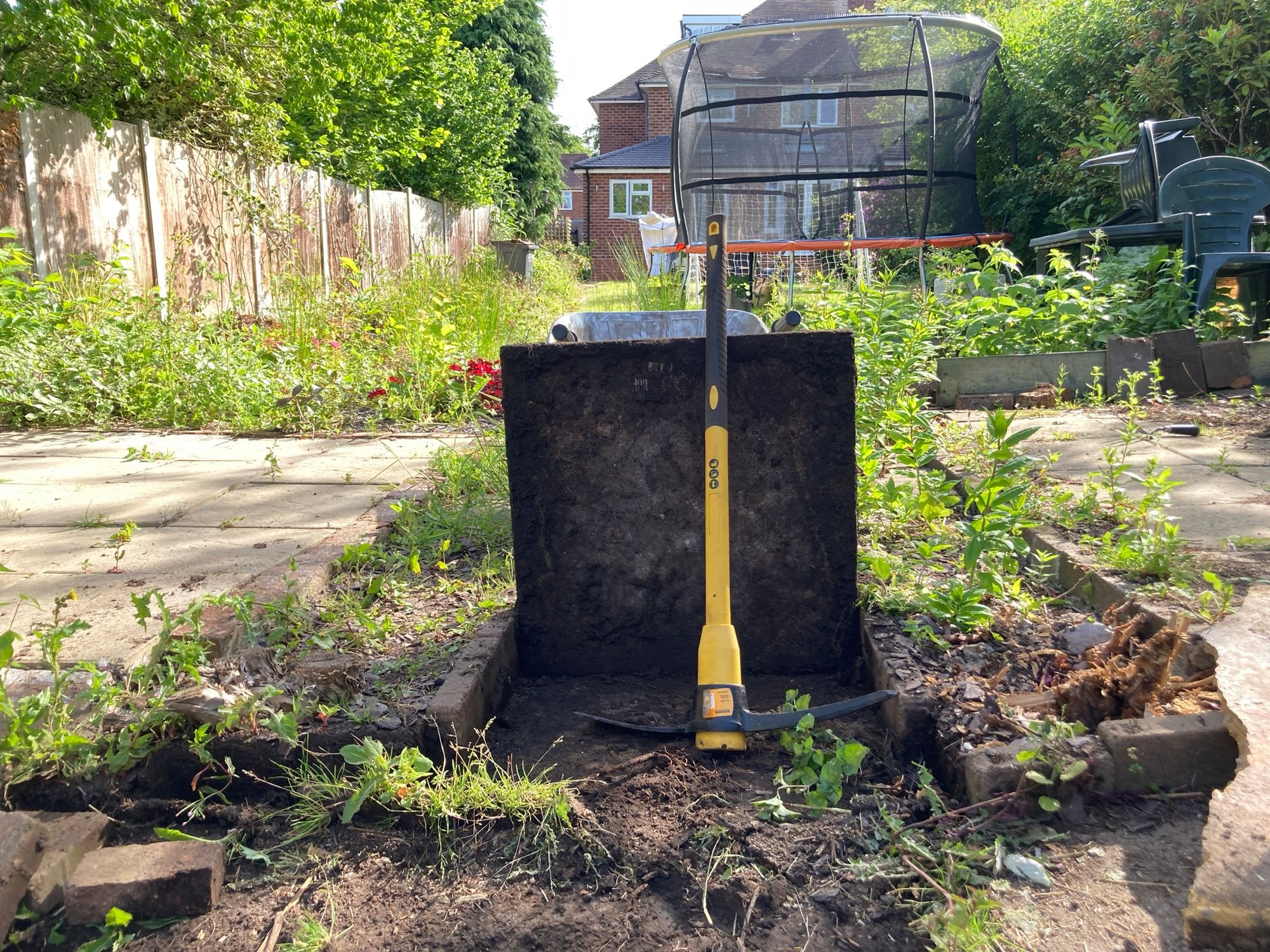 Concrete slabs and a pick axe