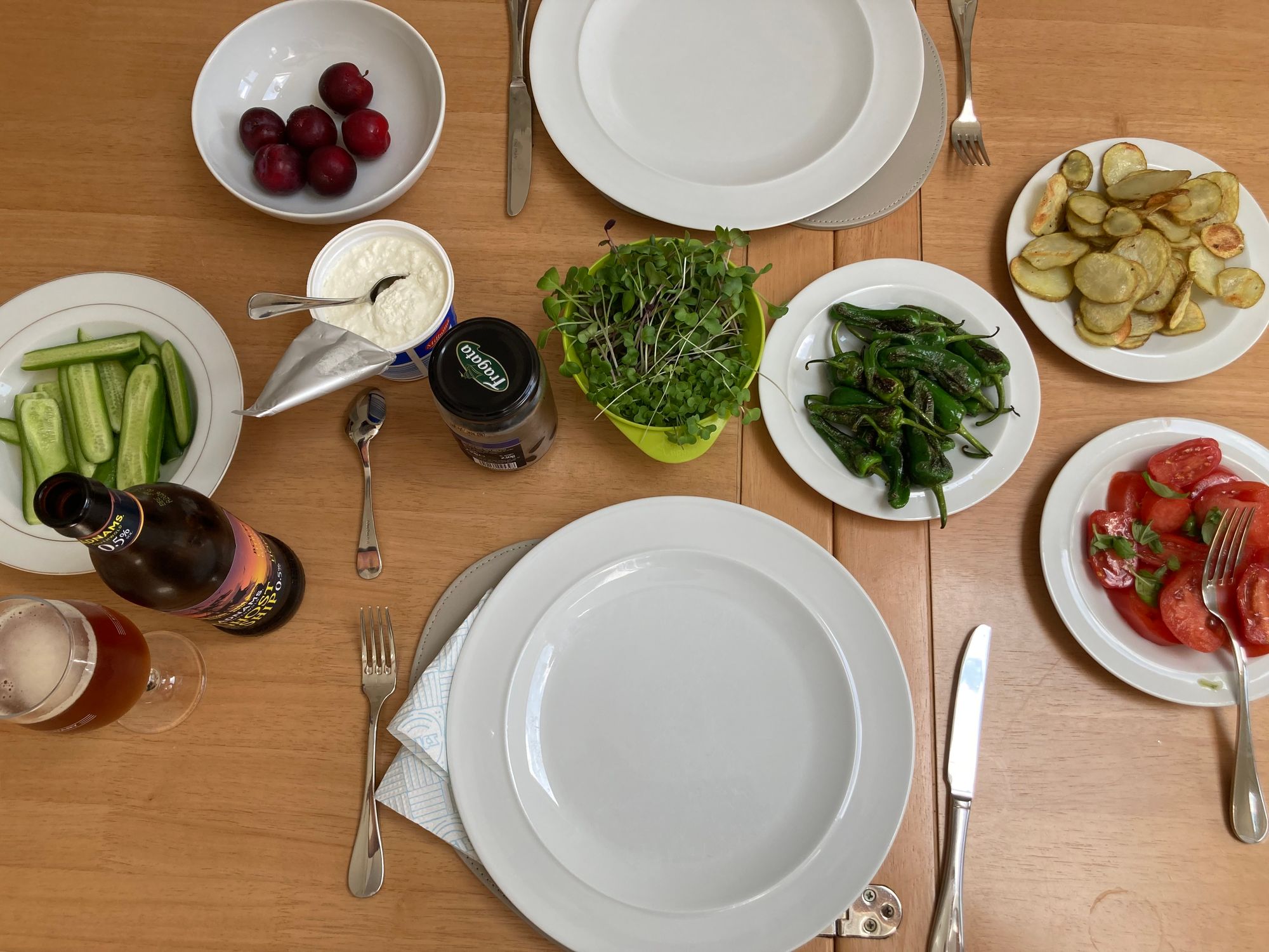 A table laid out for a meal of various salads